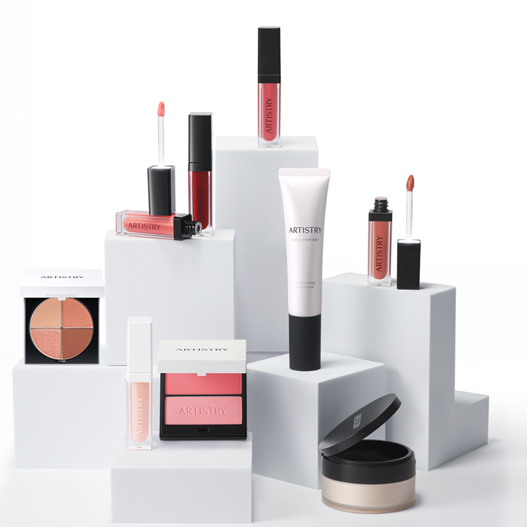 A pedestal display of Artistry makeup products