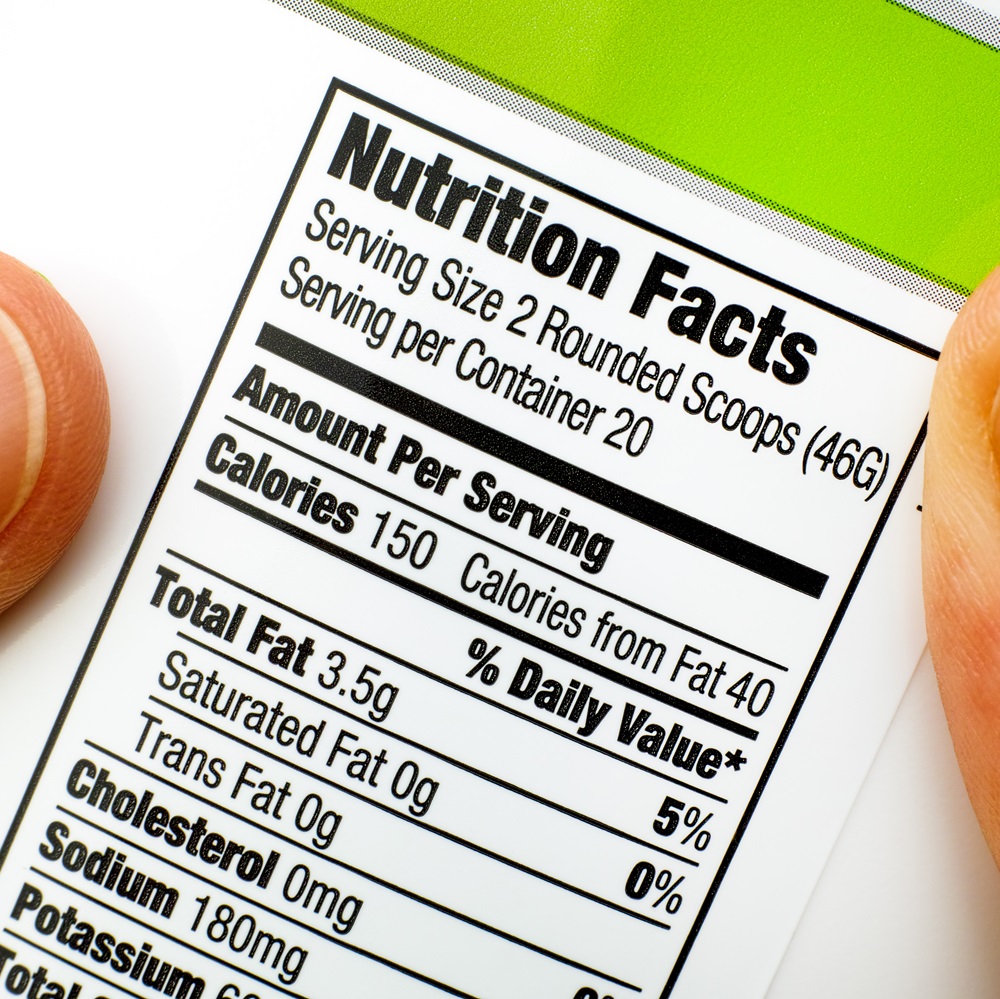 A Nutrition Facts label on a container of protein powder showing the serving size, calorie content and other nutritional information.